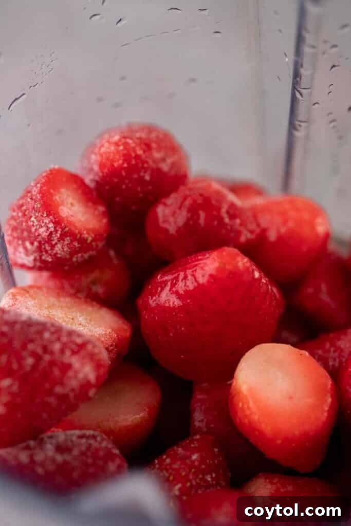 Blending process captured, showing the ingredients swirling in the blender.