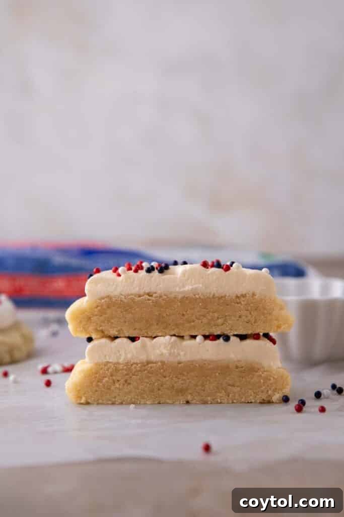 Crumbl All-American Birthday Cake Cookies 4 A stack of perfectly frosted Crumbl patriotic cookies