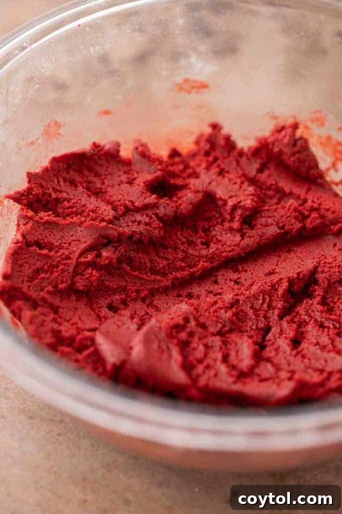 Crumbl red velvet cupcake cookie dough in a bowl