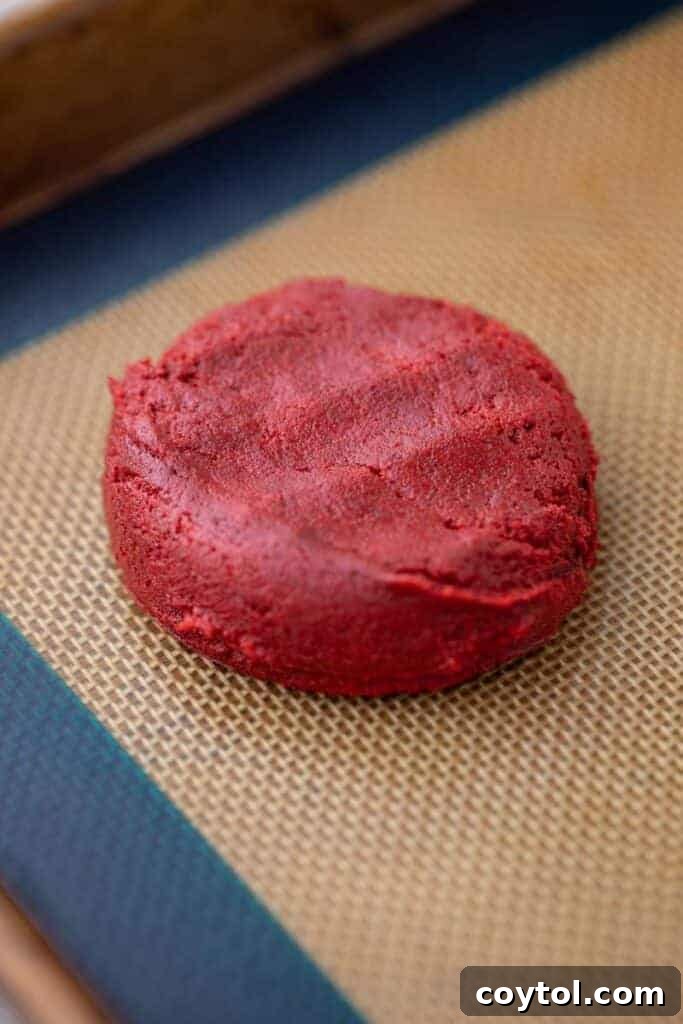 Crumbl red velvet cupcake cookie dough on baking pan