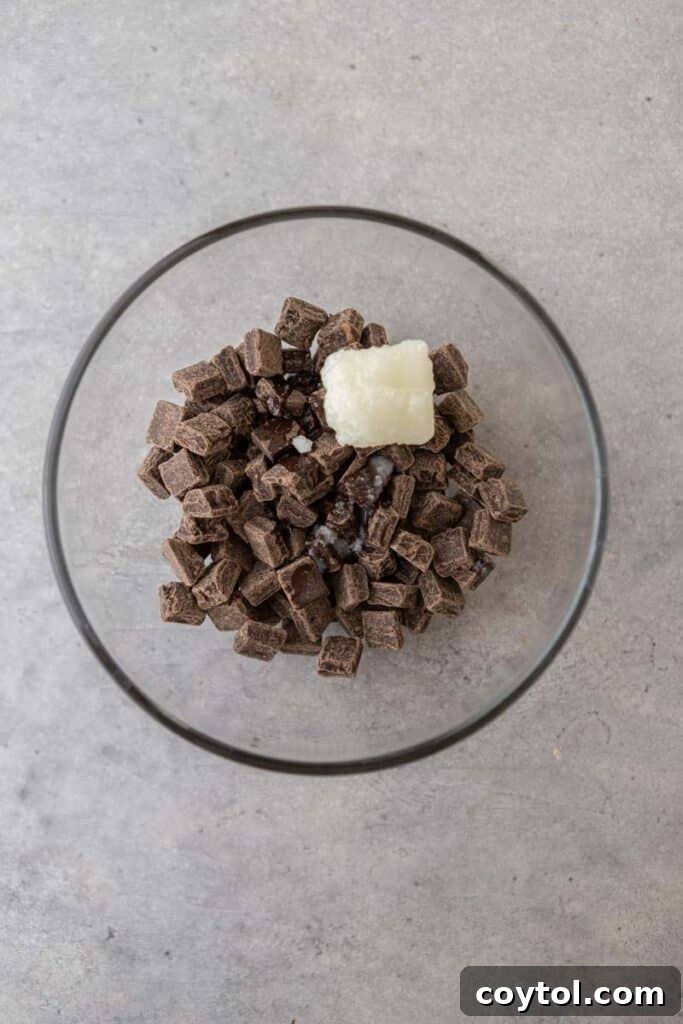 Decadent Chocolate Strawberry Yogurt Bites 8 Chocolate chips and coconut oil in a microwave-safe bowl, prepared for melting into a smooth coating