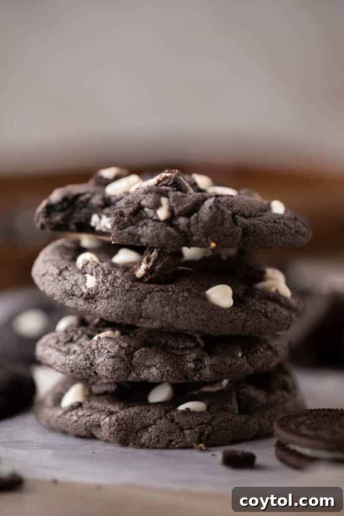 Crumbl Chocolate Cookie Cream Bliss 10 Stack of freshly baked Crumbl chocolate cookies and cream cookies with white chocolate drizzle