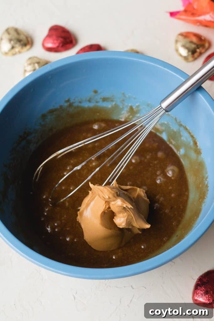 Reese's Heart Peanut Butter Blondies 15 Step-by-step process of mixing peanut butter blondie batter