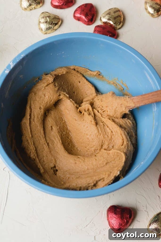 Reese's Heart Peanut Butter Blondies 18 Pouring the peanut butter blondie batter into a baking pan