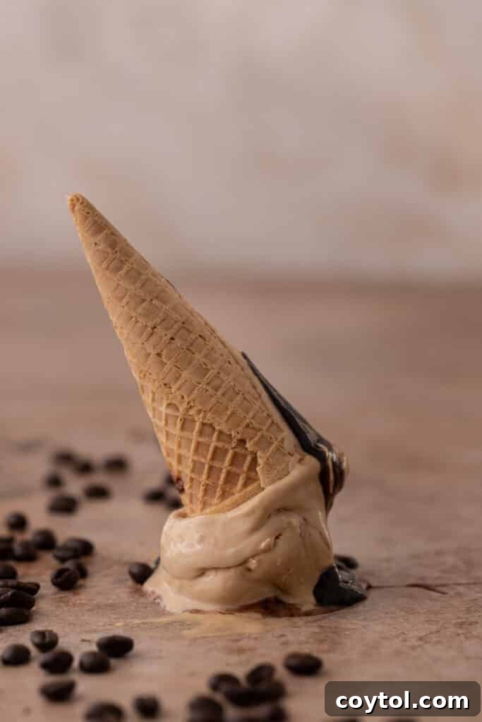 A crisp ice cream cone sits upside down, ready to be filled with creamy coffee ice cream.