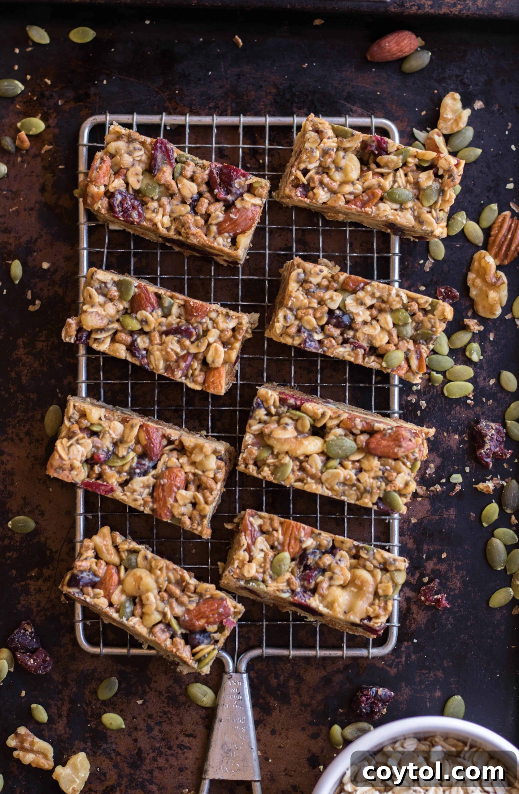 A stack of perfectly cut, healthy trail mix granola energy bars.
