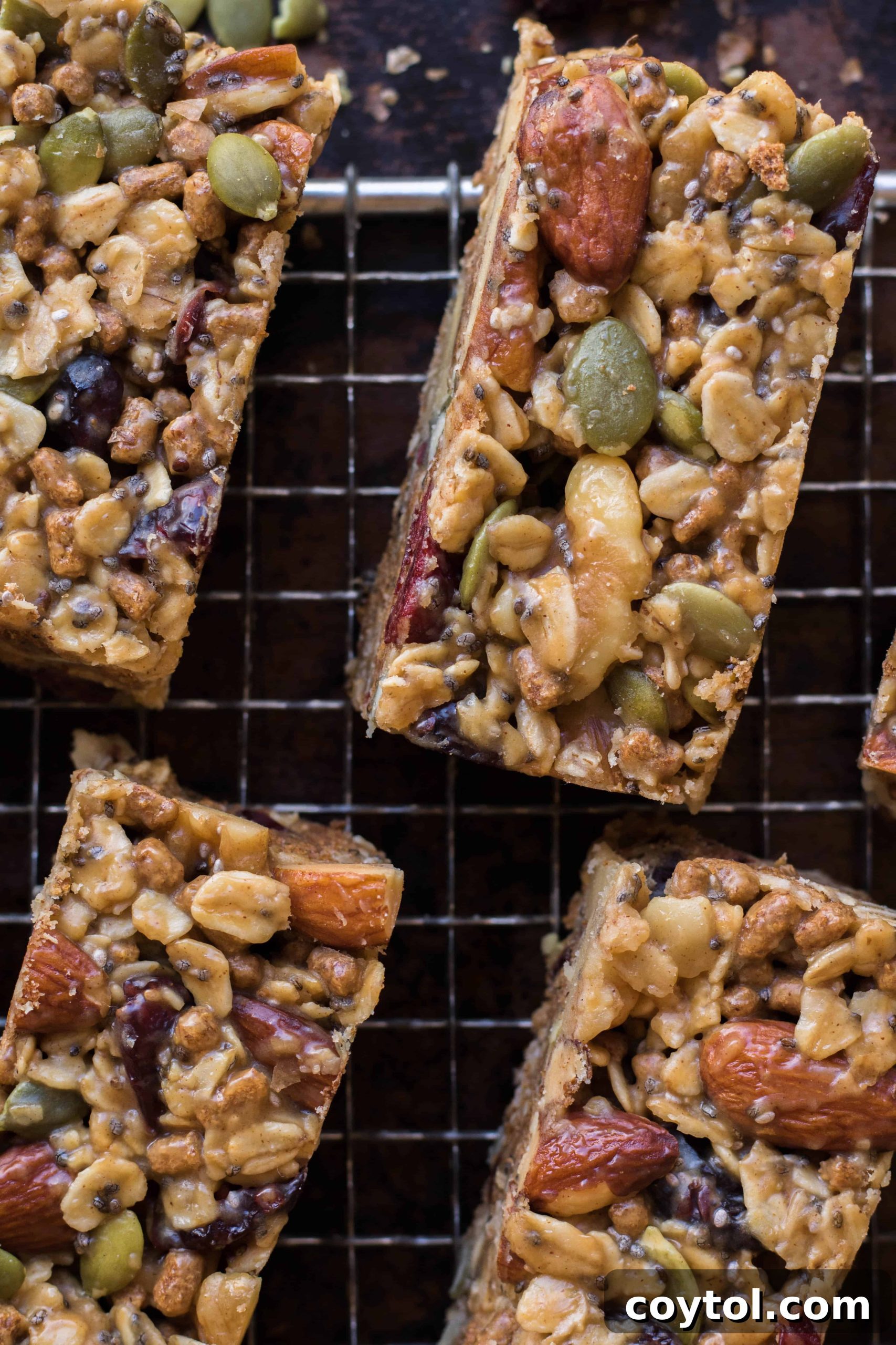 Trail mix energy bars stacked neatly, showcasing their wholesome texture.