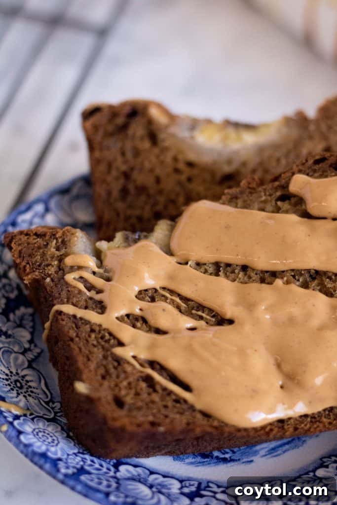 Delicious loaf of no sugar added banana bread, perfectly golden brown and sliced