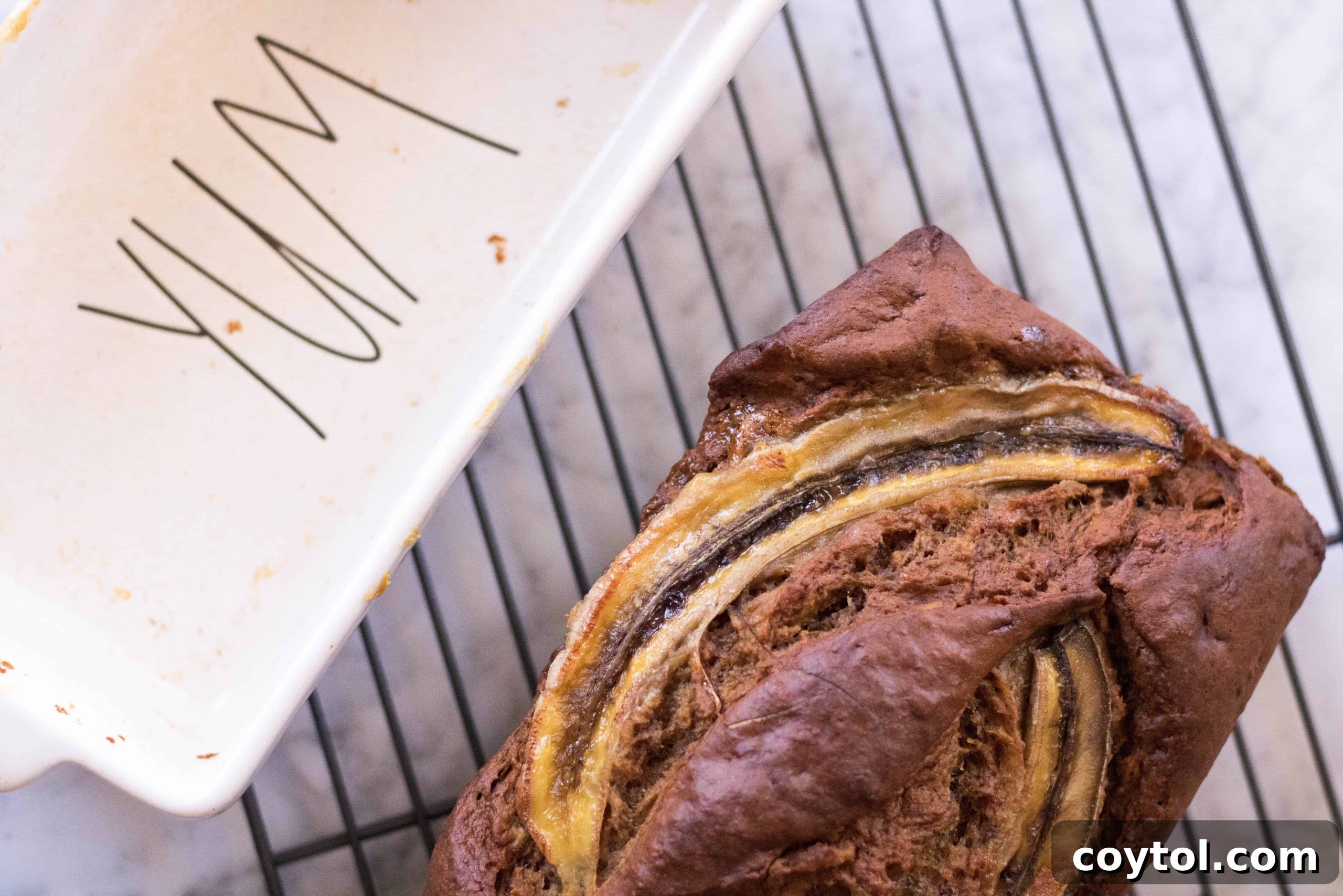 Close-up of a perfectly baked banana bread loaf, showing its moist texture