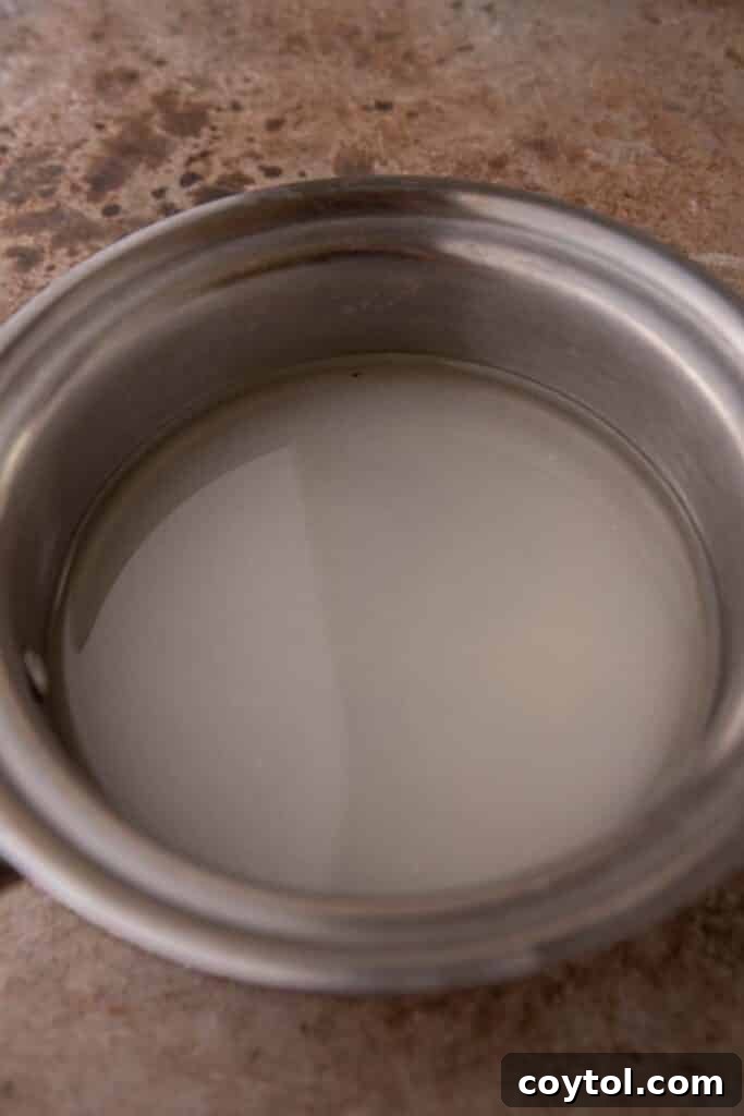 Ultimate Homemade Caramel Coffee Syrup 4 Sugar and water in a pot