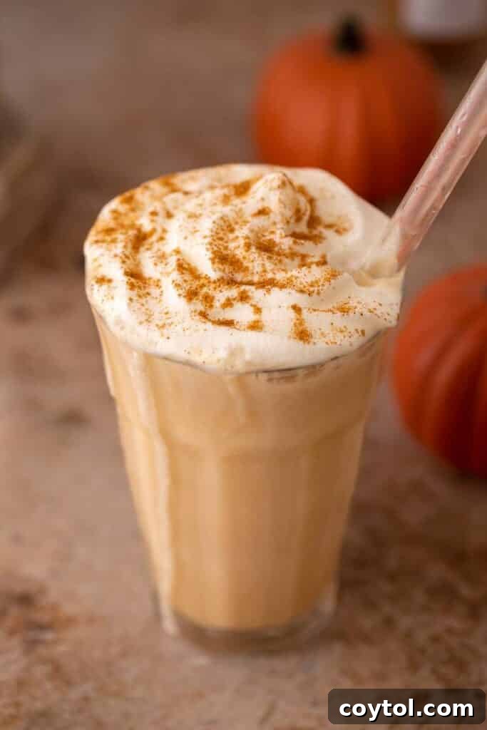 Close-up of a copycat Starbucks Pumpkin Spice Frappuccino with perfect texture and topping.