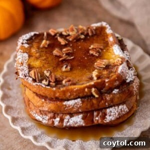 Pumpkin french toast with pecans and maple syrup on top
