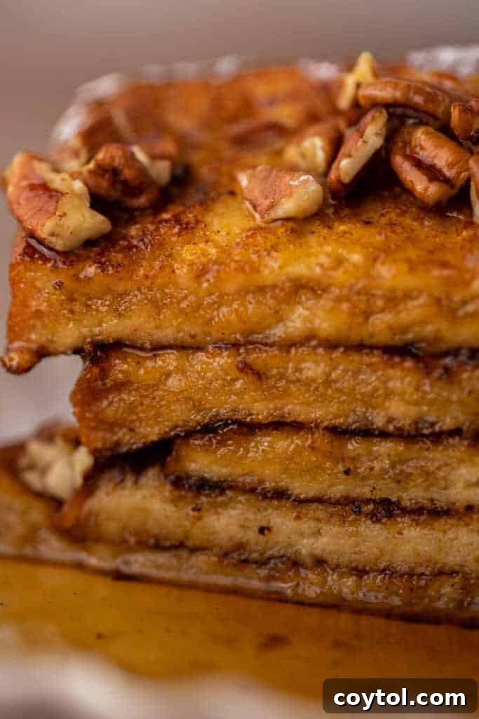 Effortless Pumpkin French Toast Delight 9 A close-up view of golden-brown pumpkin French toast, showcasing its rich texture and inviting fall colors.