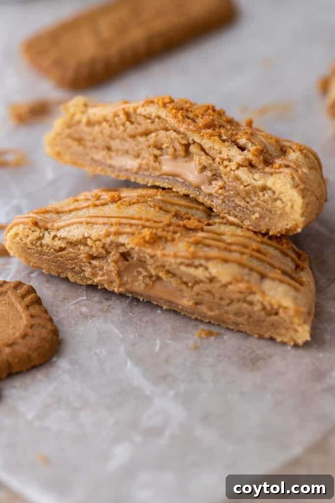 Close up of Crumbl cookies sliced in half, showing the gooey cookie butter lava.