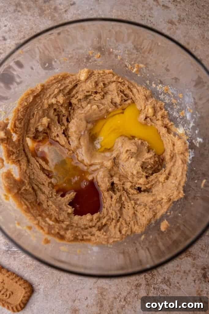 Wet ingredients being mixed in a bowl.