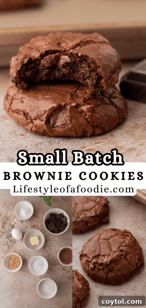 Three perfectly baked small batch brownie cookies stacked, with one gently broken to reveal the fudgy interior, on a cooling rack.