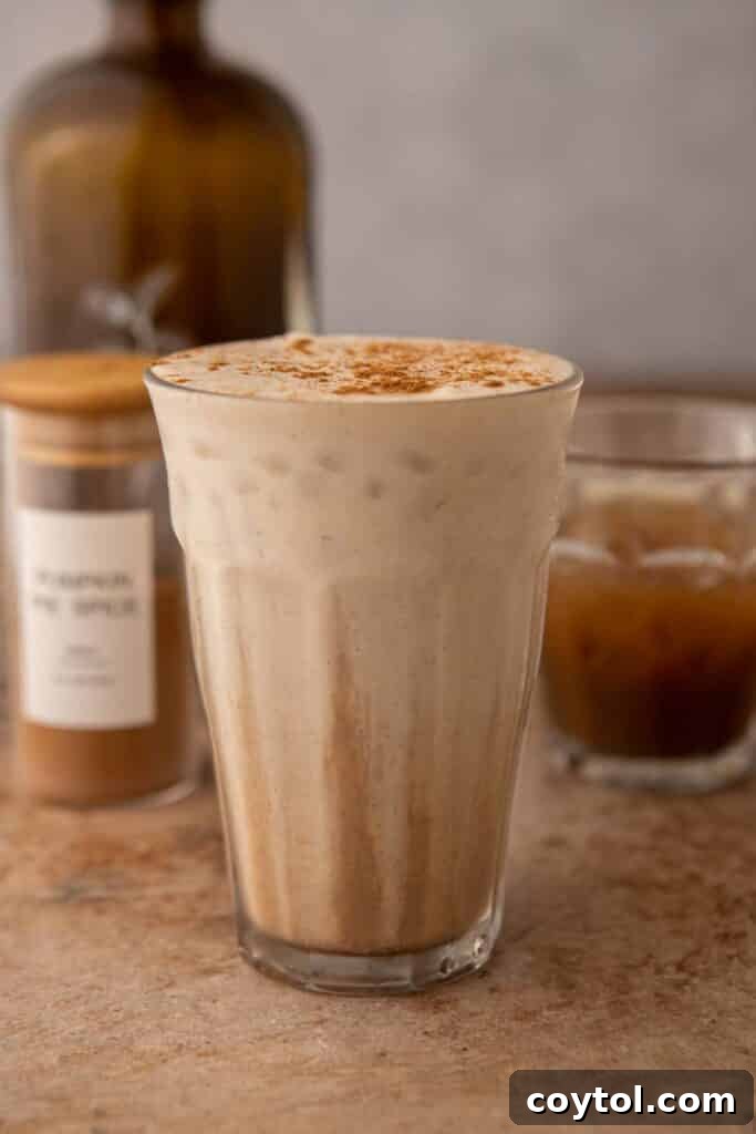 Starbucks' Latest Fall Delight: The Iced Pumpkin Cream Chai Latte 11 Tall glass of Starbucks pumpkin cream chai tea latte