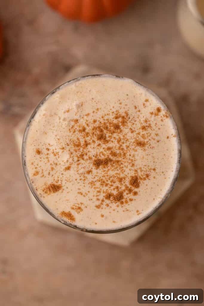 Starbucks' Latest Fall Delight: The Iced Pumpkin Cream Chai Latte 4 Overhead shot of Starbucks Iced Pumpkin Cream Chai Tea Latte