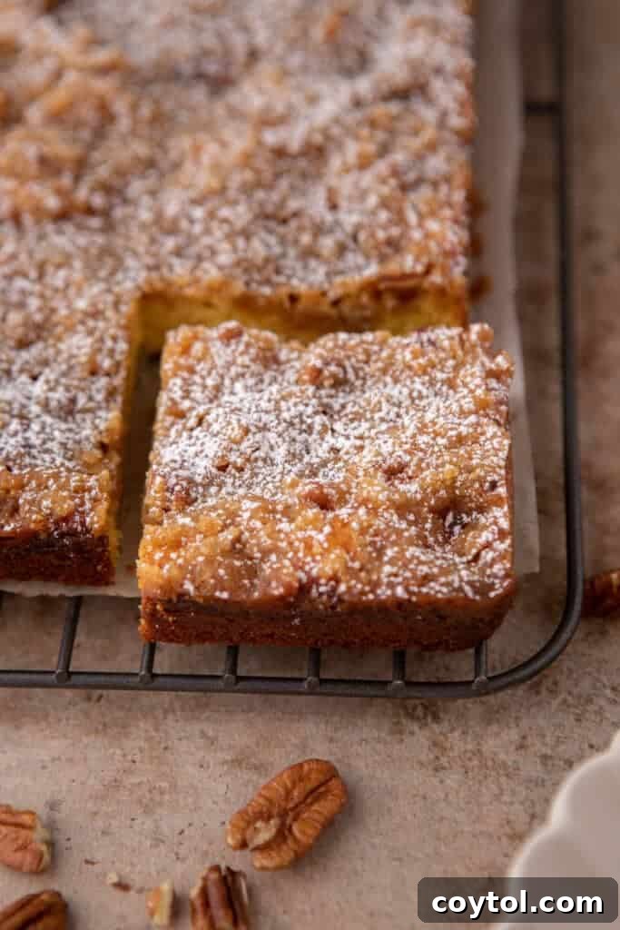 Coffee cake slice cooling on a rack