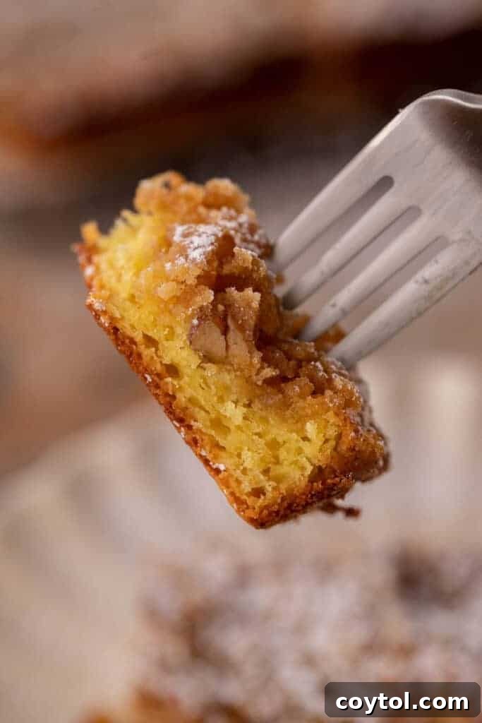 A slice of yellow cake mix coffee cake on a fork