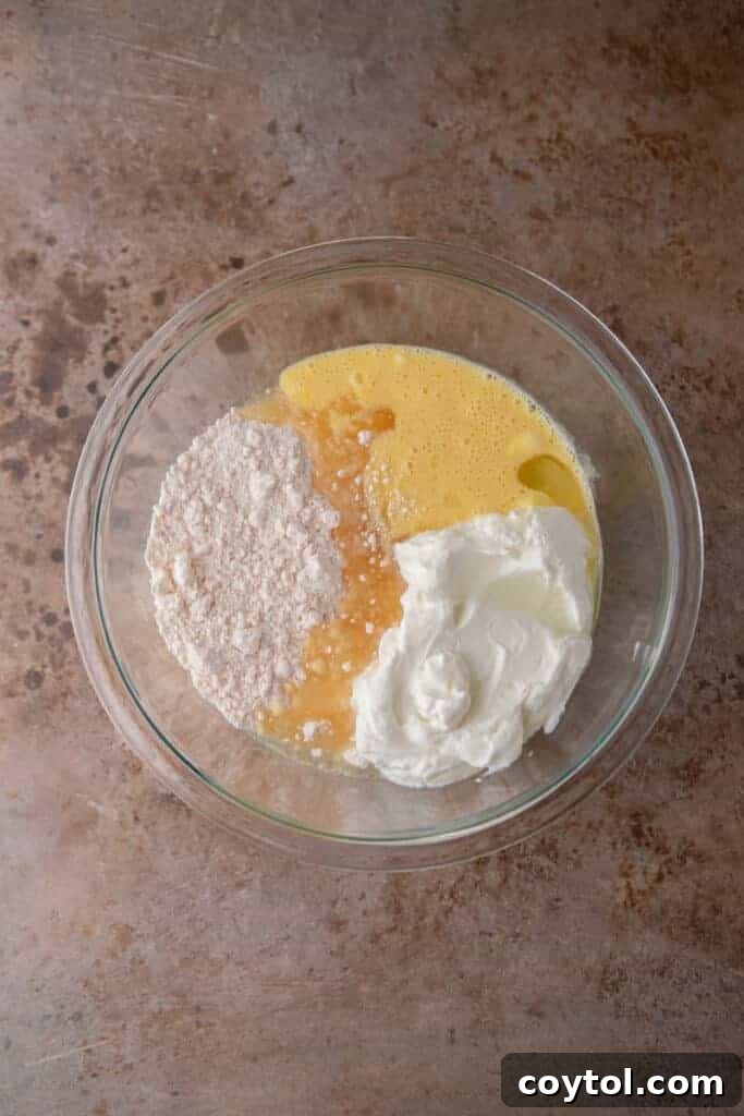 Cake ingredients combined in a bowl before mixing