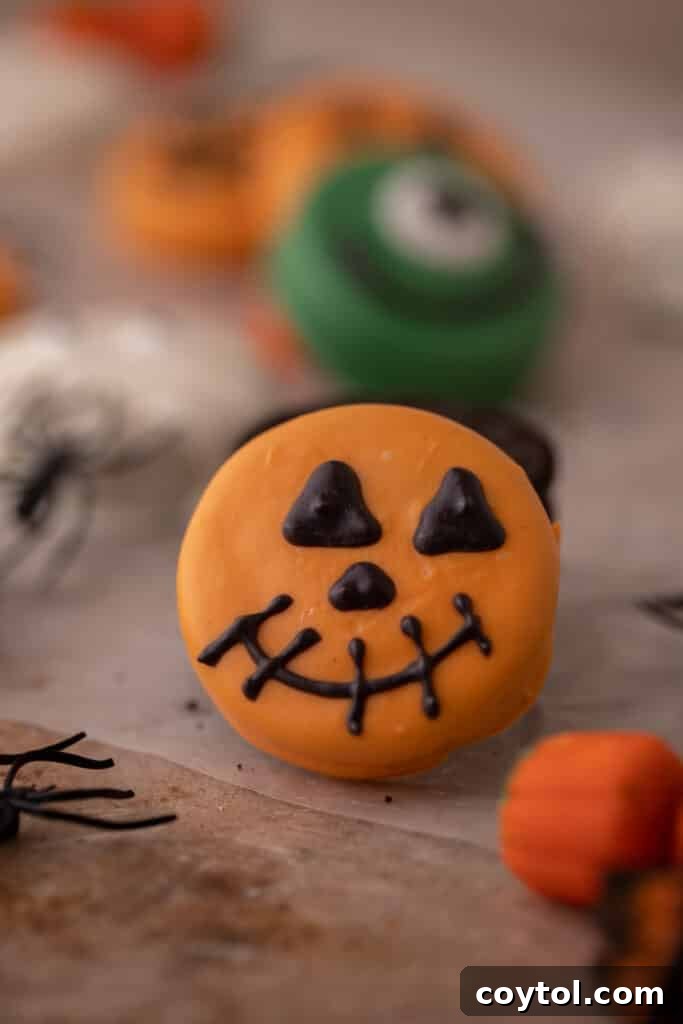 Spooktacularly Simple Chocolate Covered Halloween Oreos 12 Chocolate covered Oreos spooky halloween pumpkin