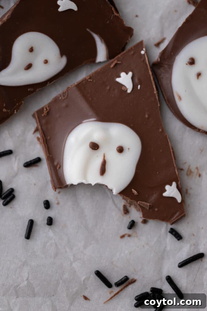 Hauntingly Easy 3-Ingredient Halloween Ghost Bark 8 halloween ghost bark piece with a bite taken out