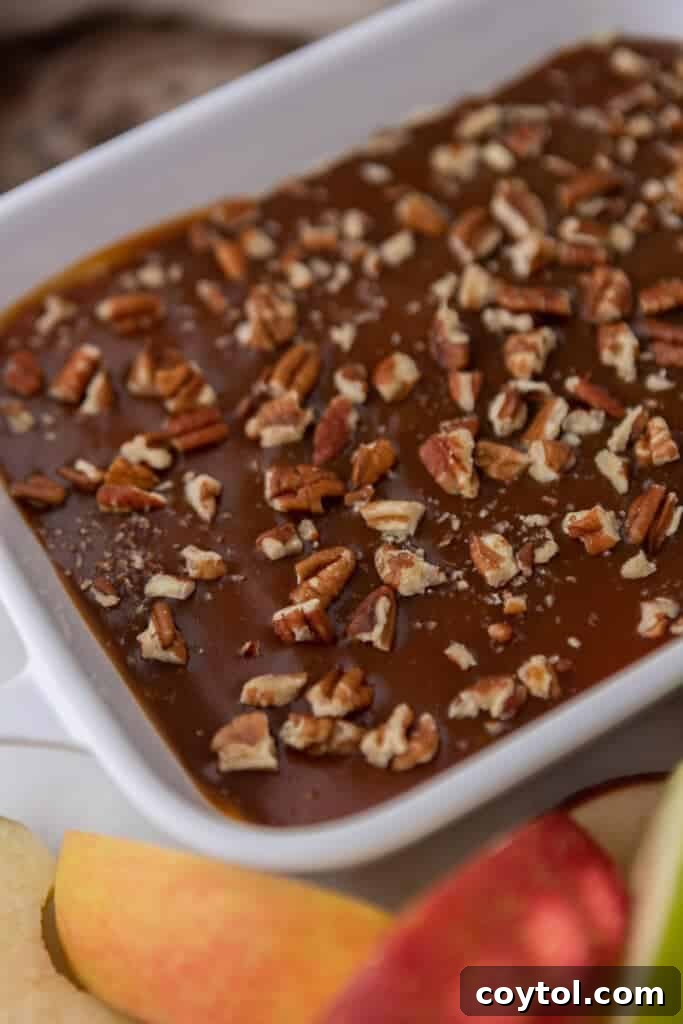 Finished caramel apple dip recipe, layered and topped with nuts
