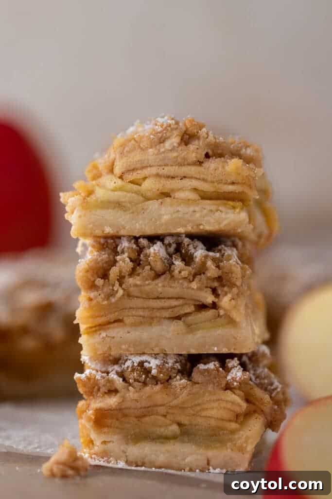 three apple pie bars stacked on top of each other