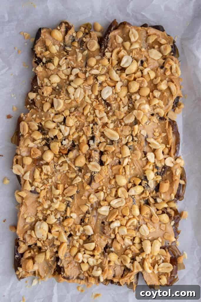 Dates with peanut butter and peanuts on top