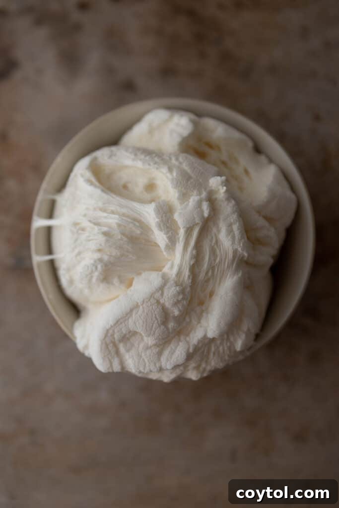 Melted marshmallows in a bowl, ready for creating spiderwebs.