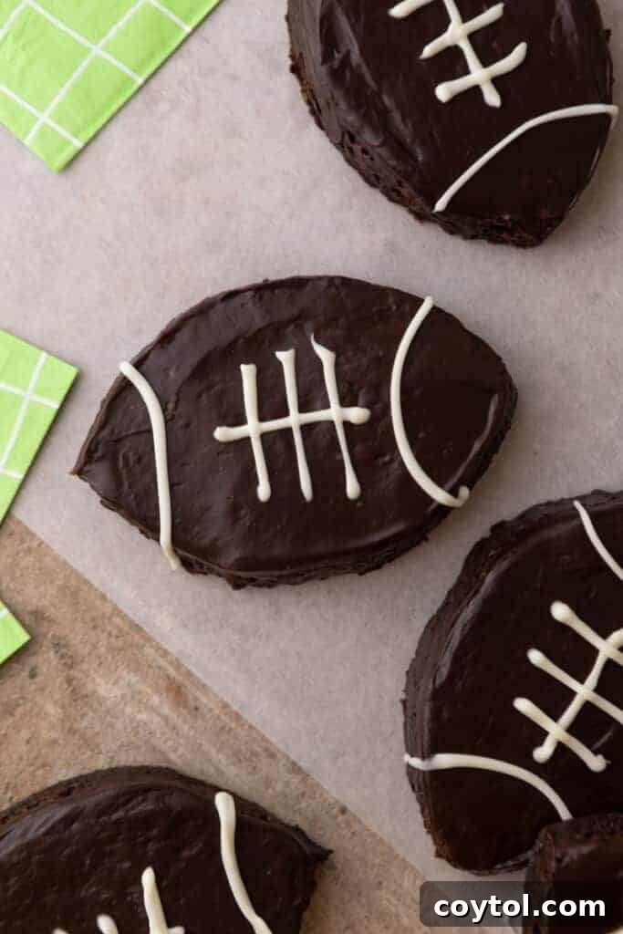 A close-up shot of a single football brownie, perfectly iced with white laces, ready to be enjoyed.