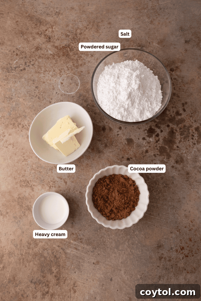 The 4-Minute Frosting Hack for Brownies 4 All the essential ingredients for making chocolate brownie frosting laid out neatly on a kitchen counter.