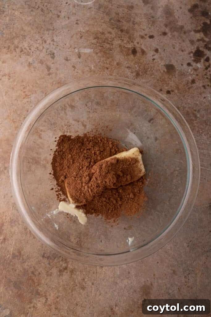 The 4-Minute Frosting Hack for Brownies 7 The initial dry ingredients, butter and cocoa powder, in a bowl before being melted for the brownie frosting recipe.