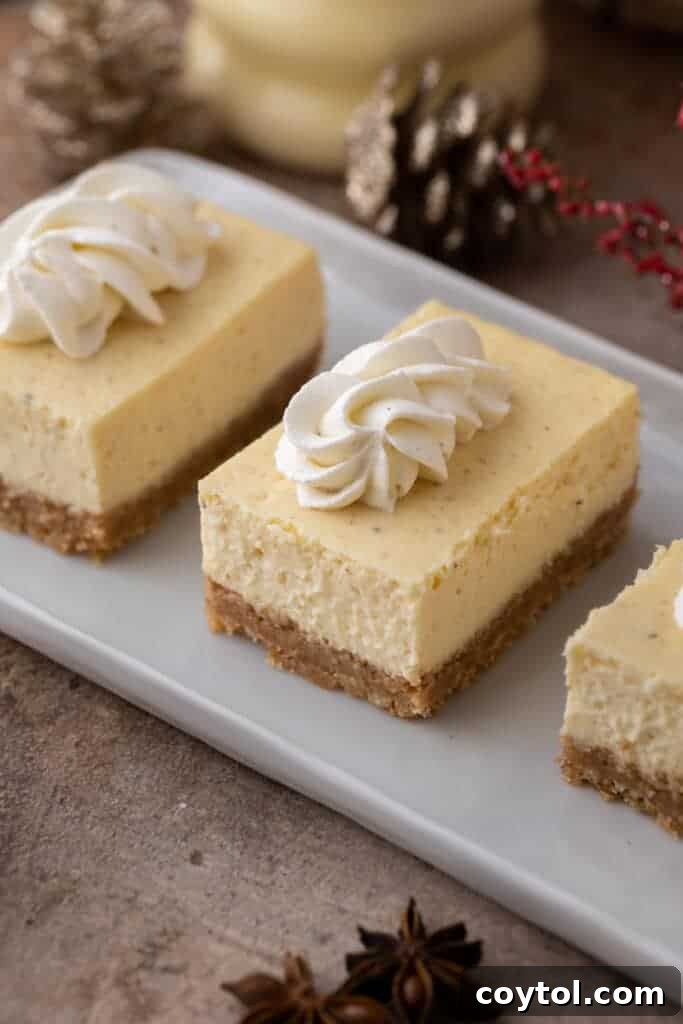 Delicious eggnog cheesecake bars arranged beautifully on a plate, ready to be served during the holiday season.