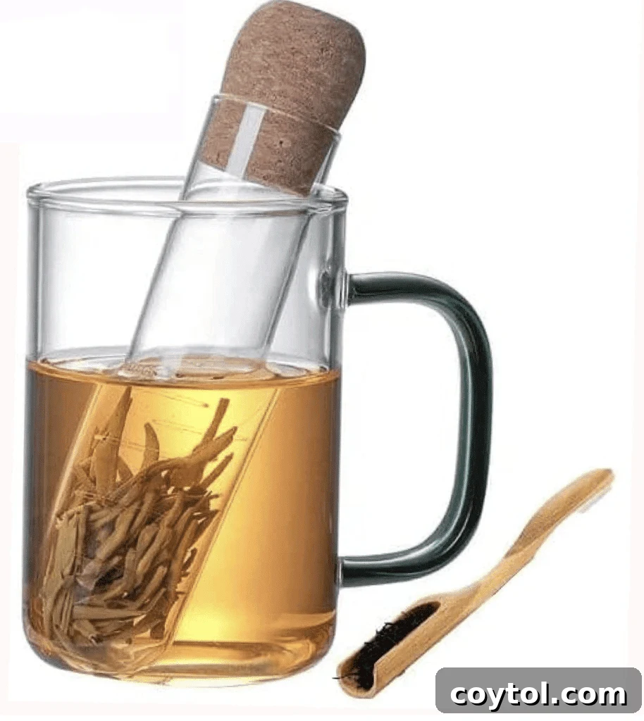 Brewing Joy: Gifts for Every Tea Lover 3 Elegant glass tea infuser with a cork lid, perfect for steeping loose leaf tea.