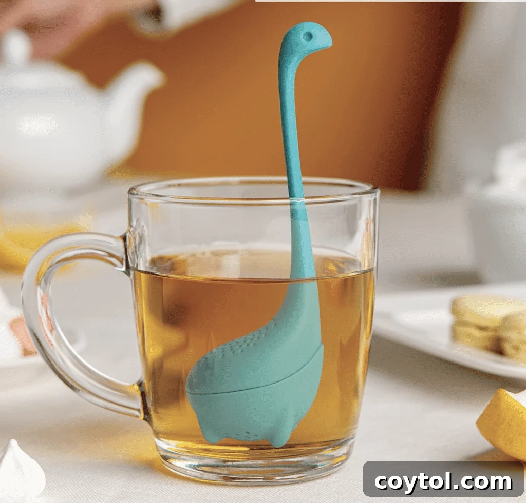 Brewing Joy: Gifts for Every Tea Lover 6 Baby Nessie loose leaf tea infuser shaped like a dinosaur.