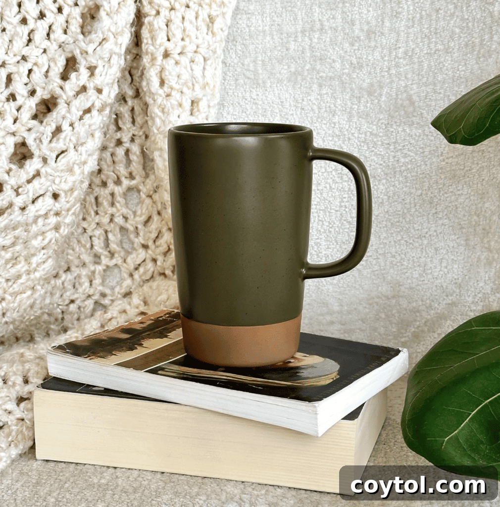 Brewing Joy: Gifts for Every Tea Lover 7 Ceramic large tea mug with integrated loose leaf infuser.