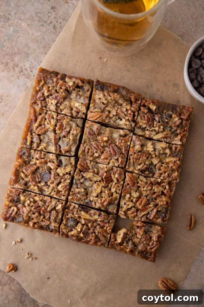 cooked and sliced chocolate pecan pie bars in the baking dish after baking