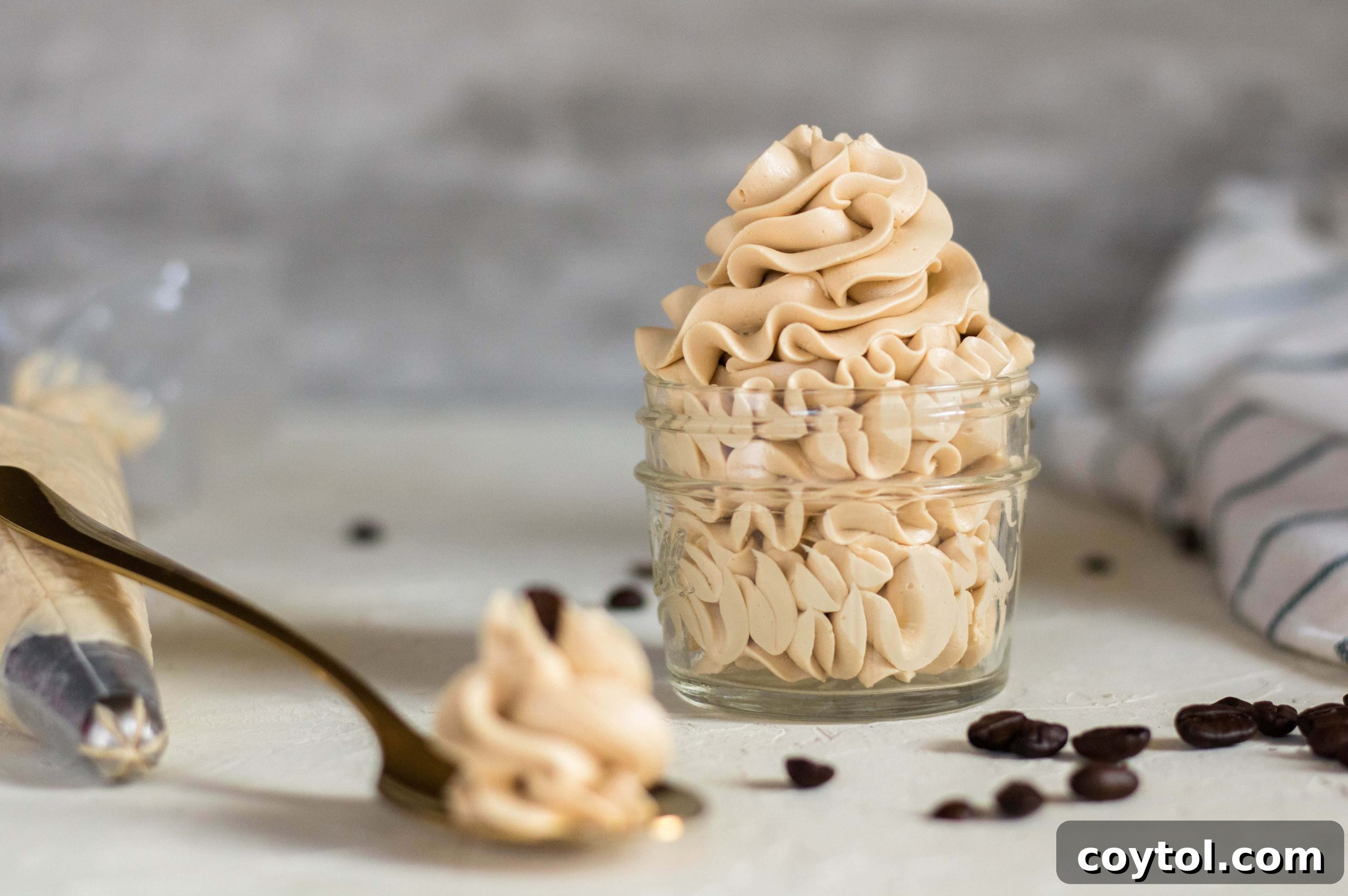 Decadent coffee frosting swirled on a cupcake, ready to be enjoyed.