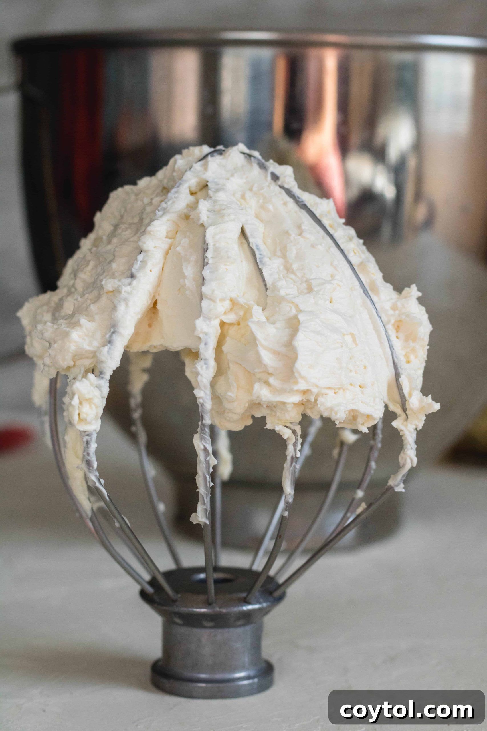 The butter and sweetened condensed milk mixture after whipping, showing a smooth, creamy texture.