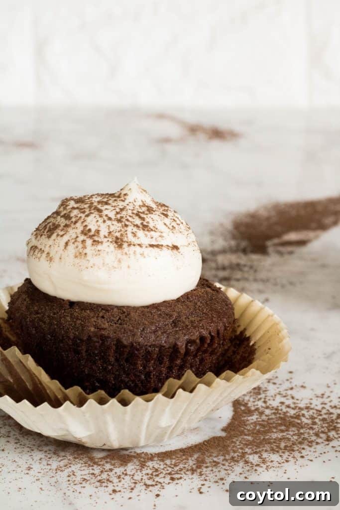 Small batch of beautiful butter cream frosting in a bowl, showing its smooth texture.