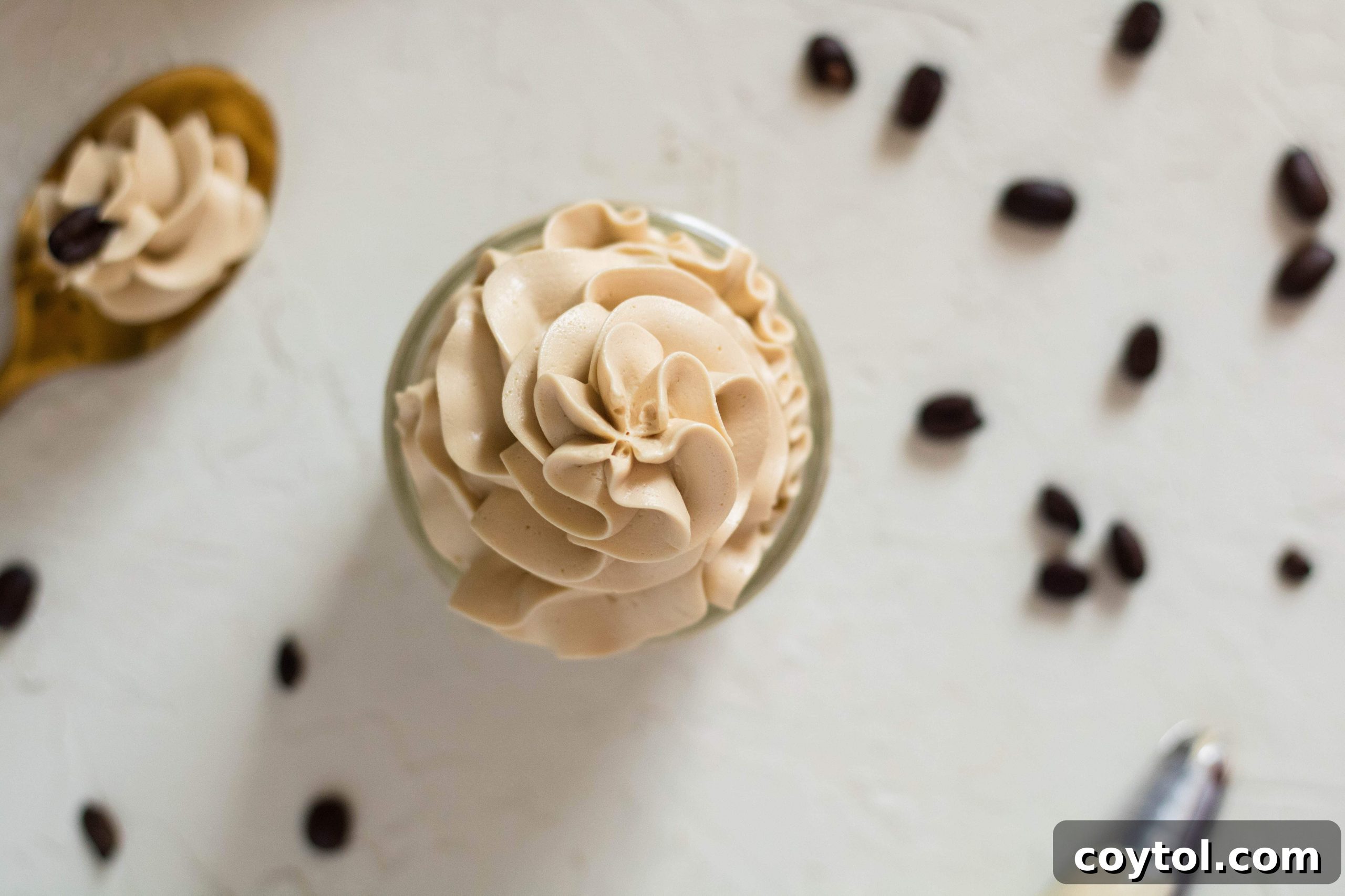 Overhead shot of the three simple ingredients for coffee frosting: butter, sweetened condensed milk, and instant coffee.