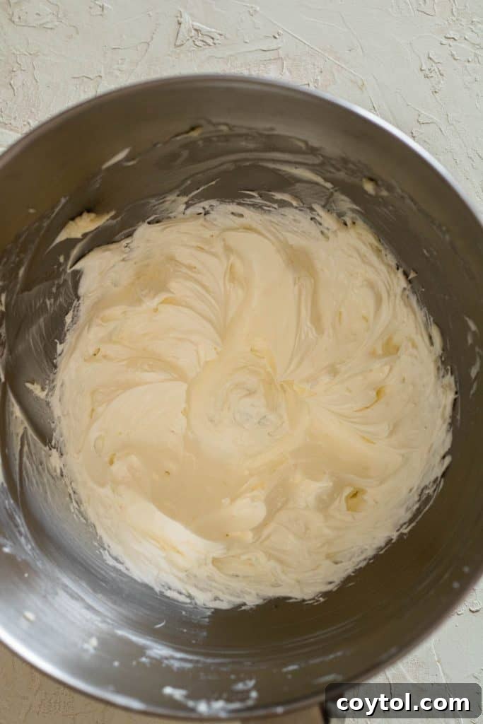 Whip up the butter for the coffee frosting recipe until light and fluffy.