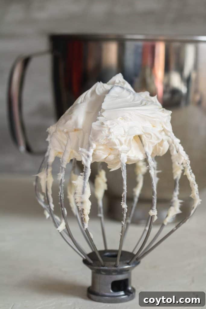Whip up the butter for the coffee frosting recipe, showing the butter turning white.