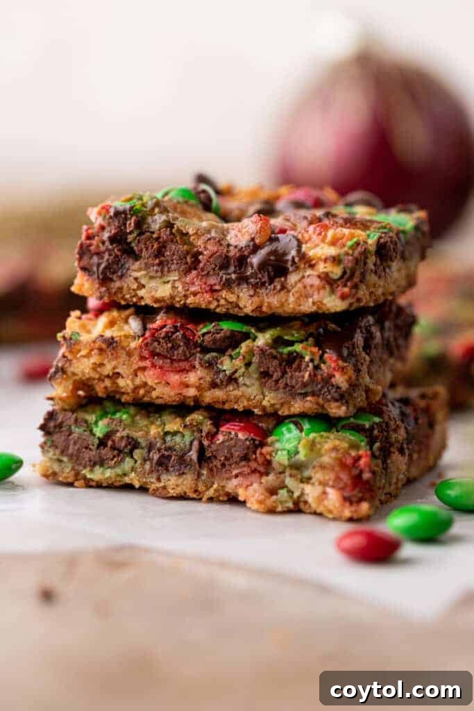 Stack of freshly baked Christmas Magic Cookie Bars, ready to be served