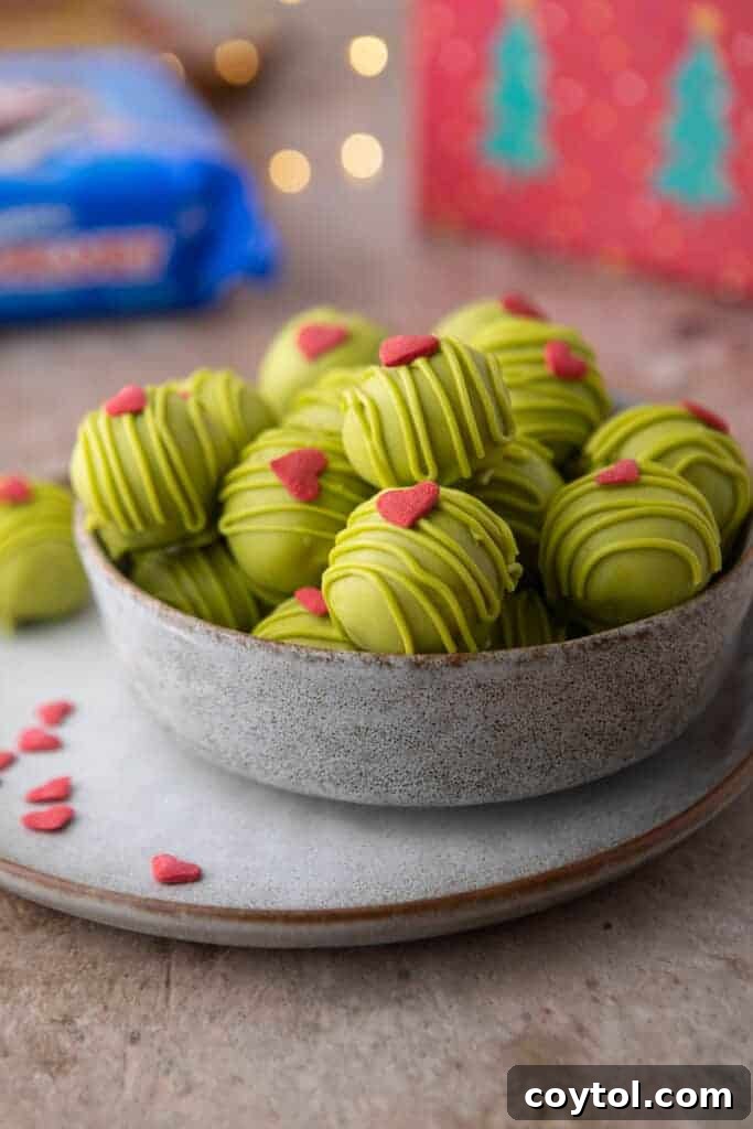 grinch oreo truffles in a bowl, showing a generous serving