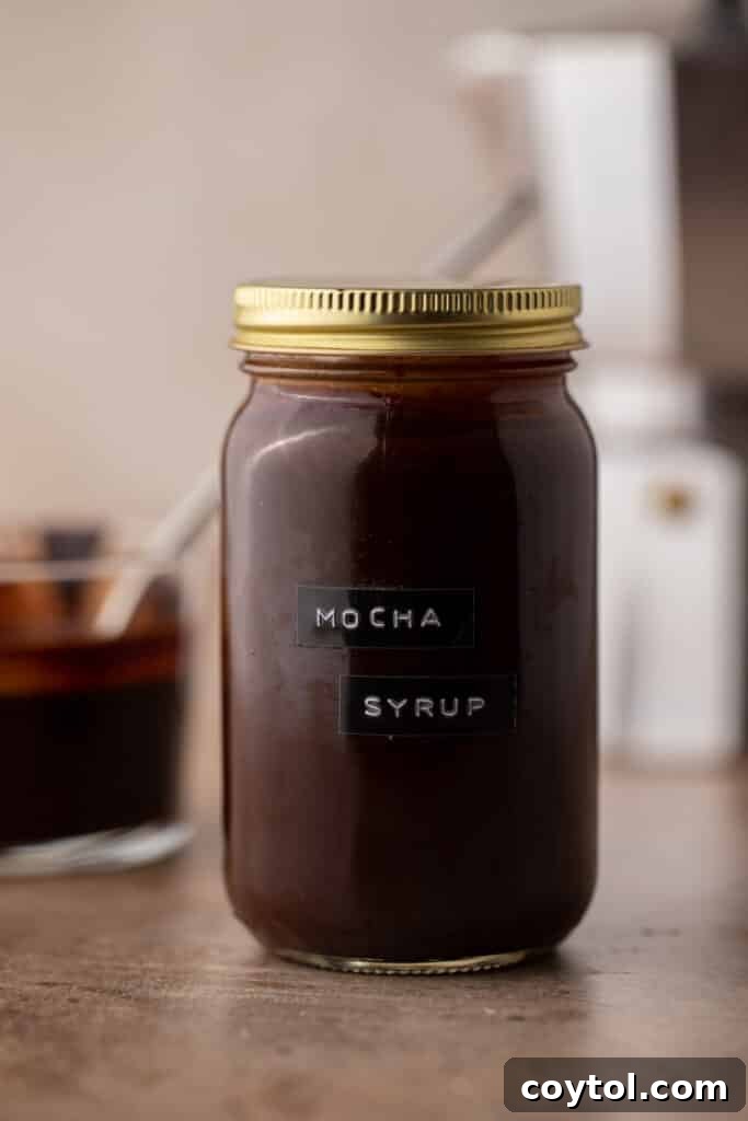 Whip Up Perfect Homemade Mocha Syrup 7 A mason jar filled with homemade mocha coffee syrup, ready for storage and use.