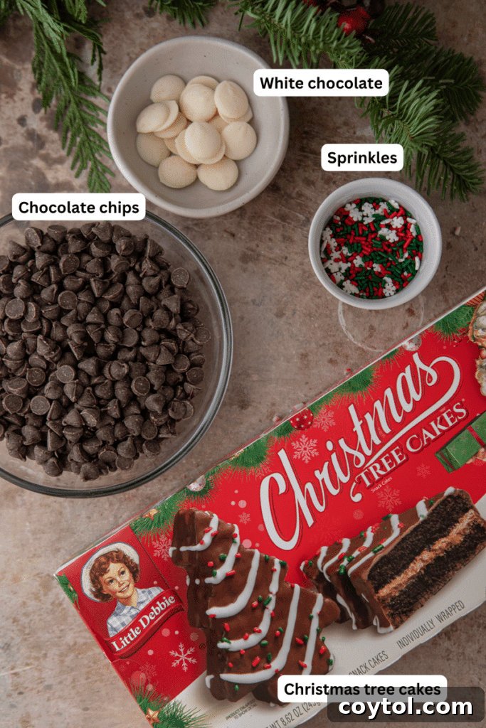 Ingredients including chocolate chips, white chocolate, sprinkles, and Little Debbie Christmas Tree Cakes.
