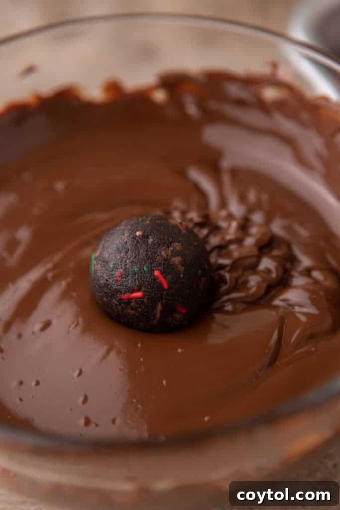 a ball being dipped in chocolate